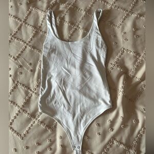 Woman’s white body suit!